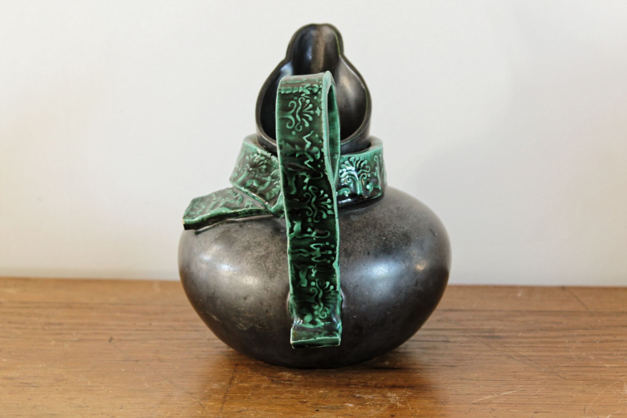 Pitcher in earthenware, metallic black