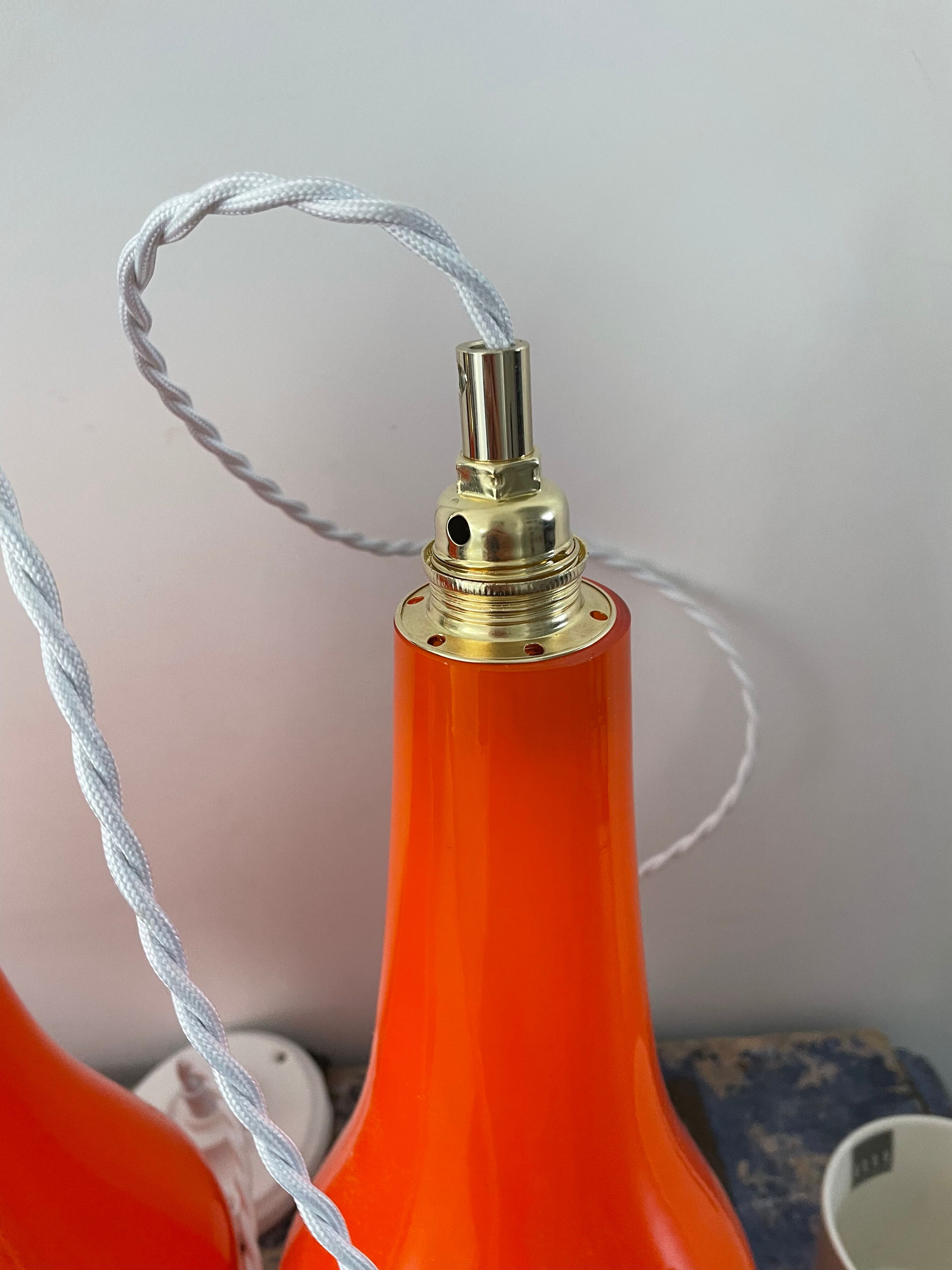 Set of three new electrified orange vintage pendant lamps