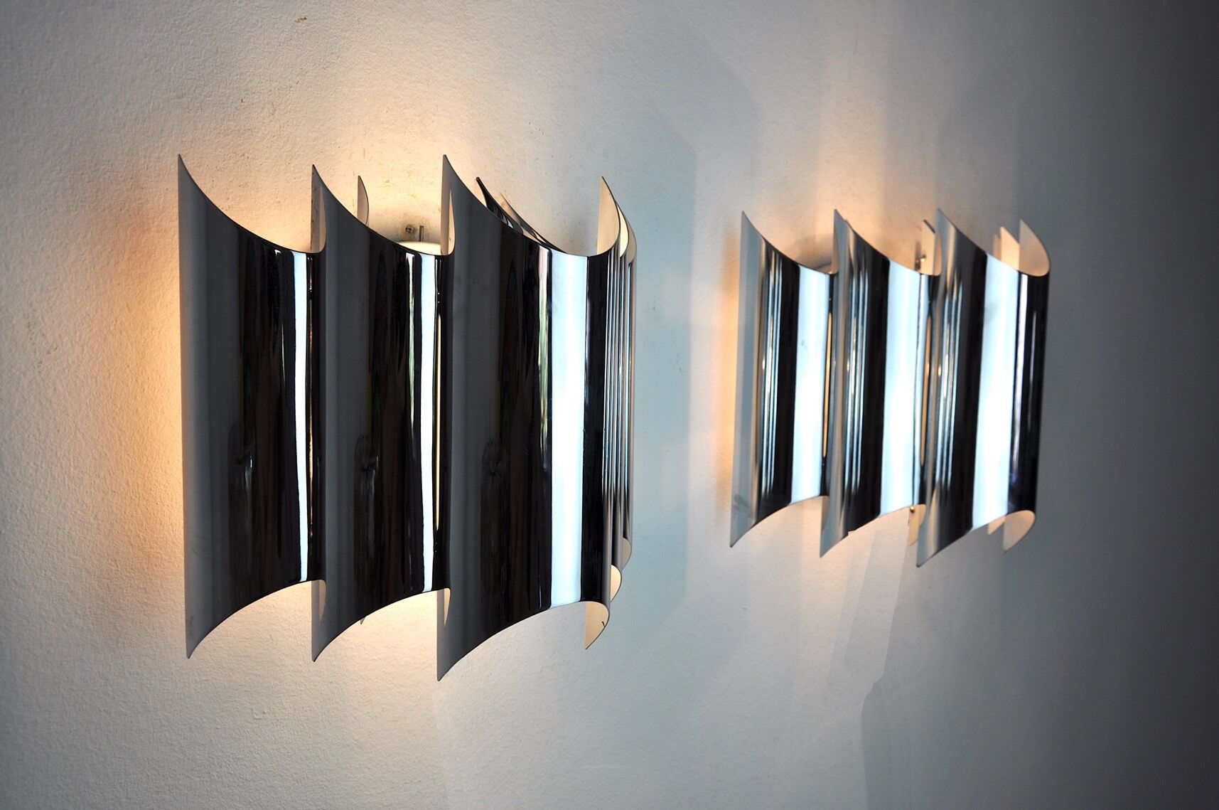 Pair of Raak wall lamps, space-age chrome design, Germany, 1970