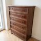 Brown antique-style wooden chest of drawers with 6 drawers.