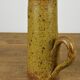 Sandstone pitcher signed "Guy Baudat"