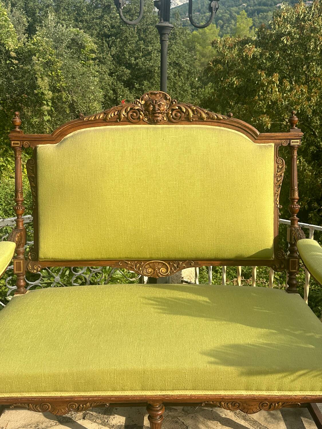 Richly carved solid wood bench in Louis XVI style.