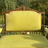 Richly carved solid wood bench in Louis XVI style.