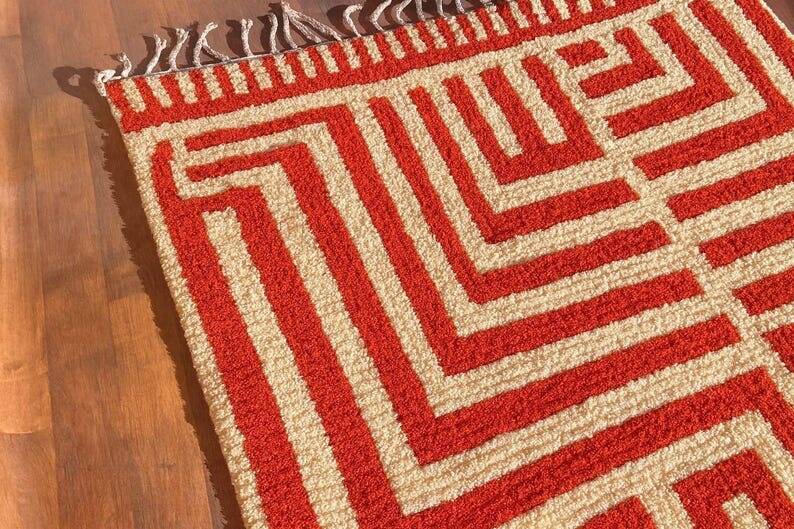 Handmade traditional orange and white Beni Ourain rug.