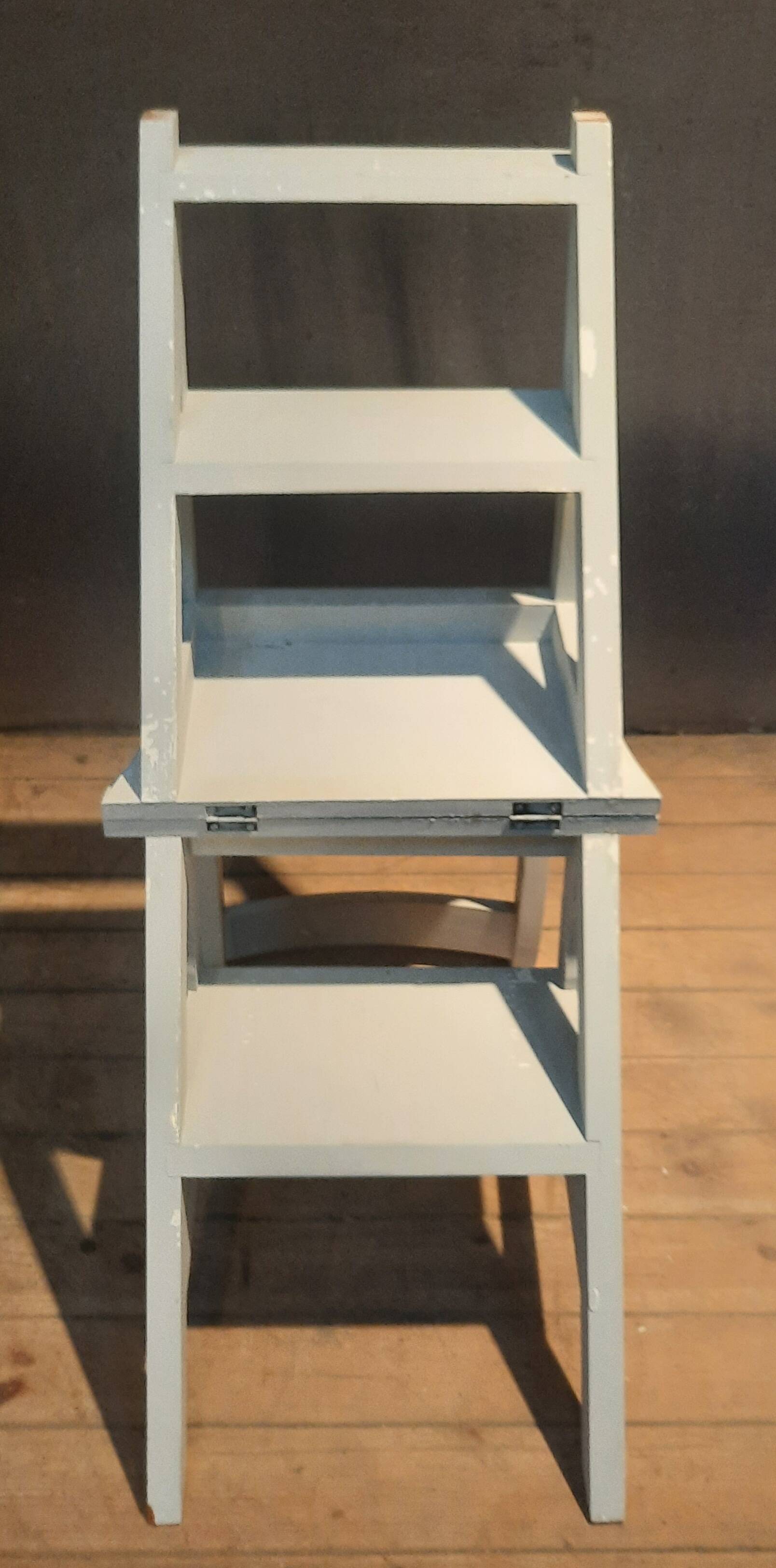 White chair convertible into a staircase.