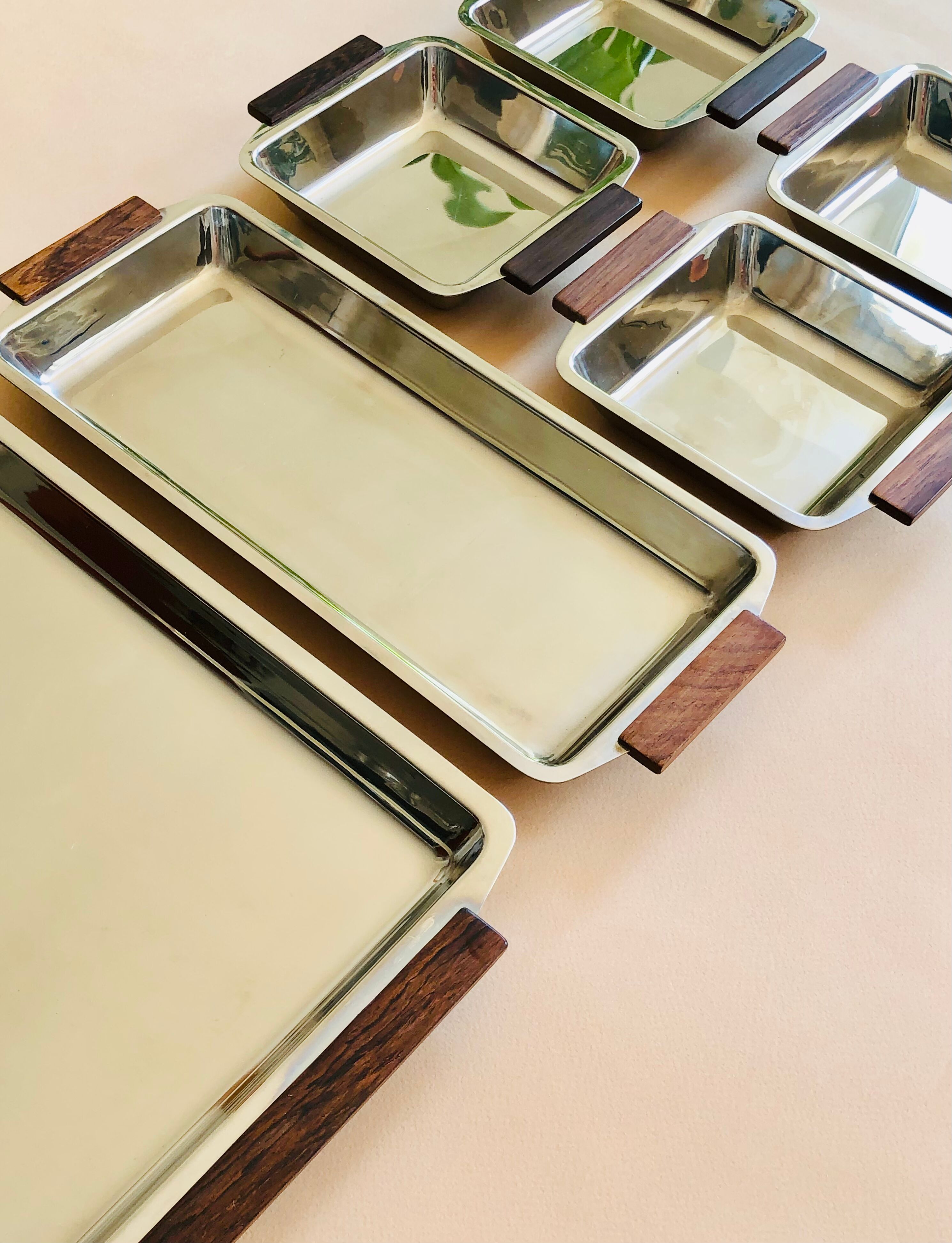 Service of Scandinavian dishes in stainless steel and teak 1970