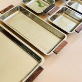 Service of Scandinavian dishes in stainless steel and teak 1970