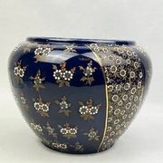 Limoges porcelain flowerpot with gold enamel decoration and blue relief flowers from Four