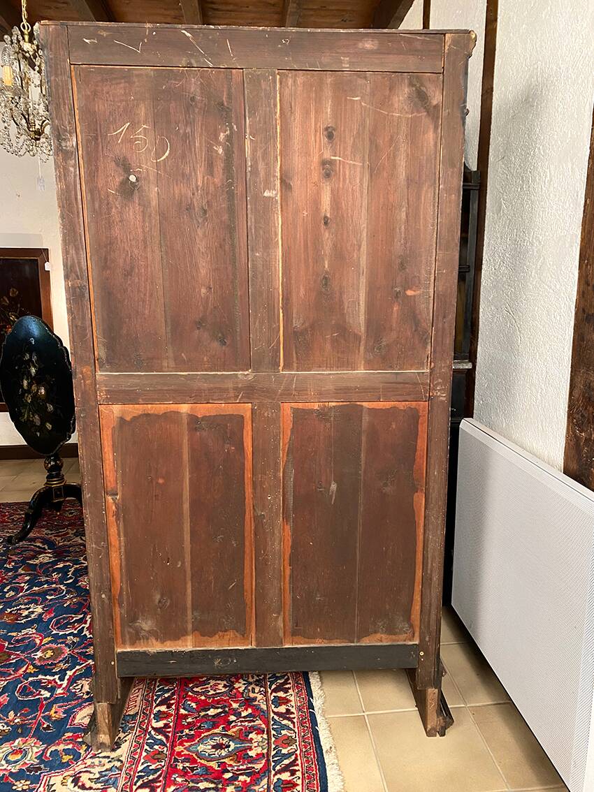 Blackened wooden display cabinet from the late 19th or early 20th century.