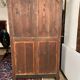 Blackened wooden display cabinet from the late 19th or early 20th century.