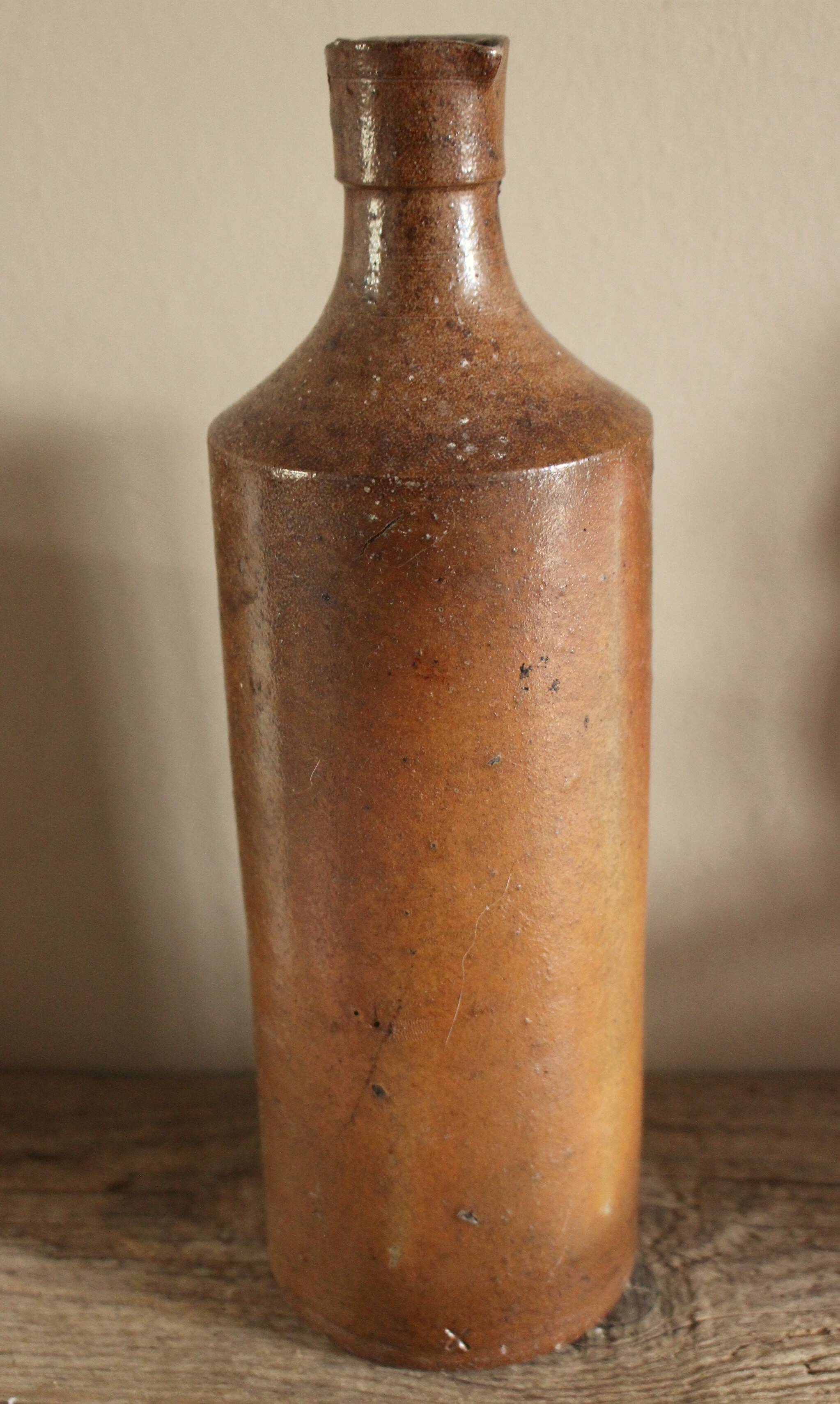 Vintage stoneware liqueur bottle with spout