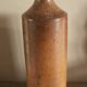 Vintage stoneware liqueur bottle with spout