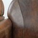 Set of 2 vintage sheepskin armchairs with a characterful appearance