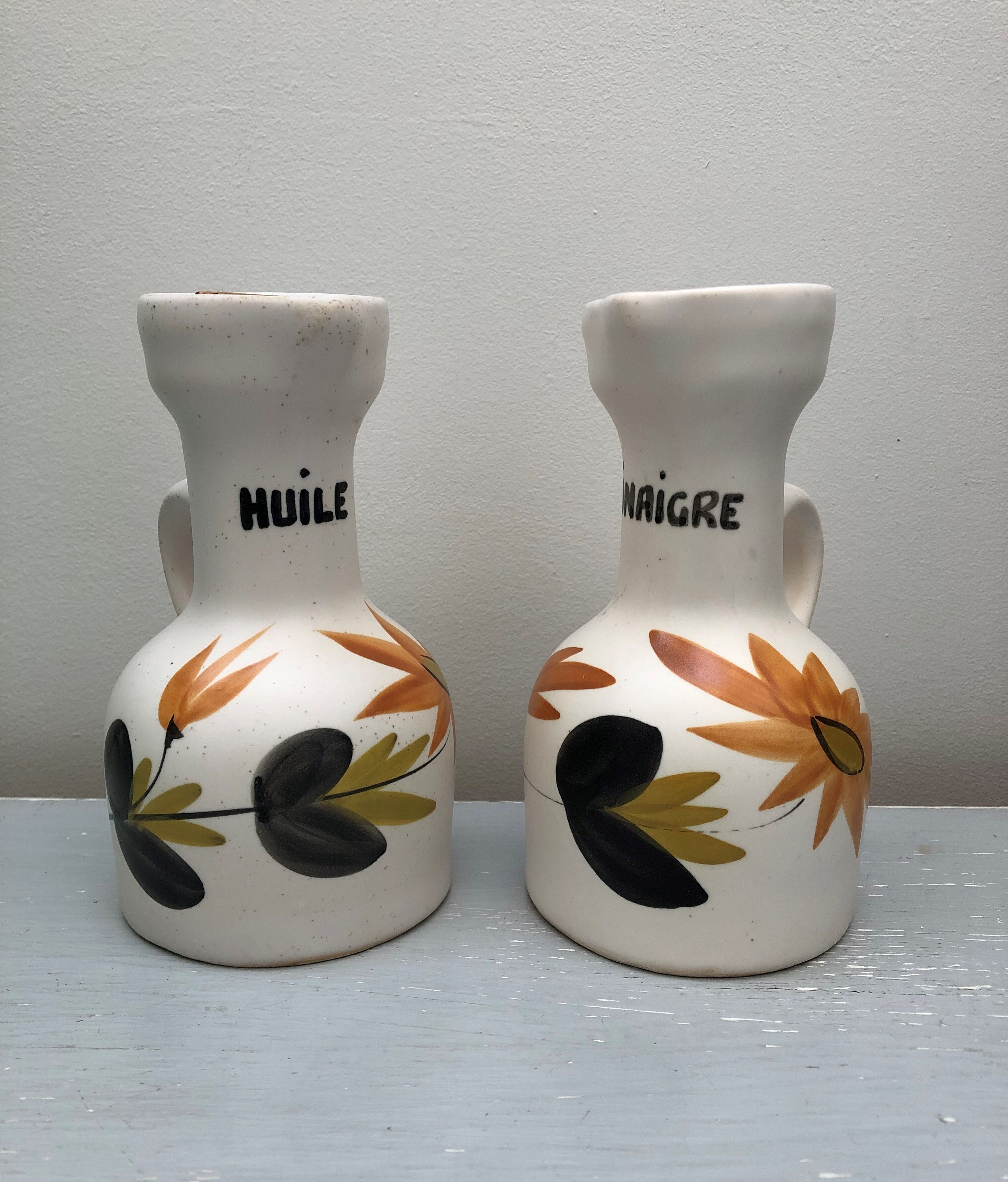 Old vinegar and oil maker with vintage decoration floral motifs