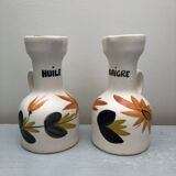 Old vinegar and oil maker with vintage decoration floral motifs