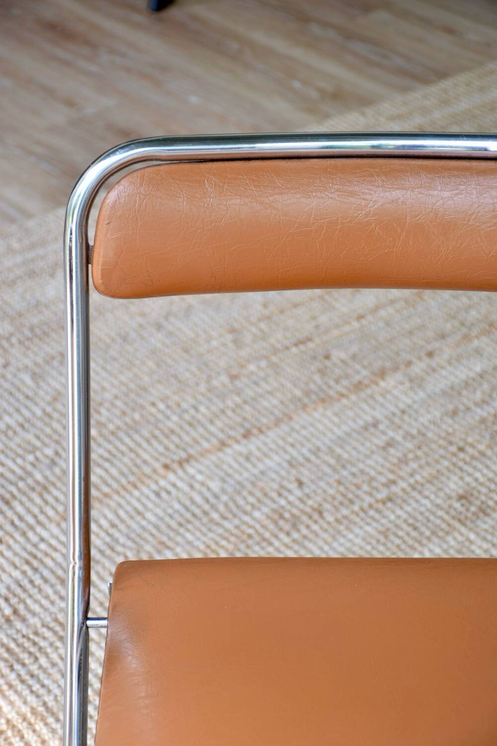 Pair of “Soudexvinyl” folding chairs in skai and chrome tube