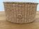 Small oval woven basket in natural blonde wicker — vintage, Czech Republic 1980s