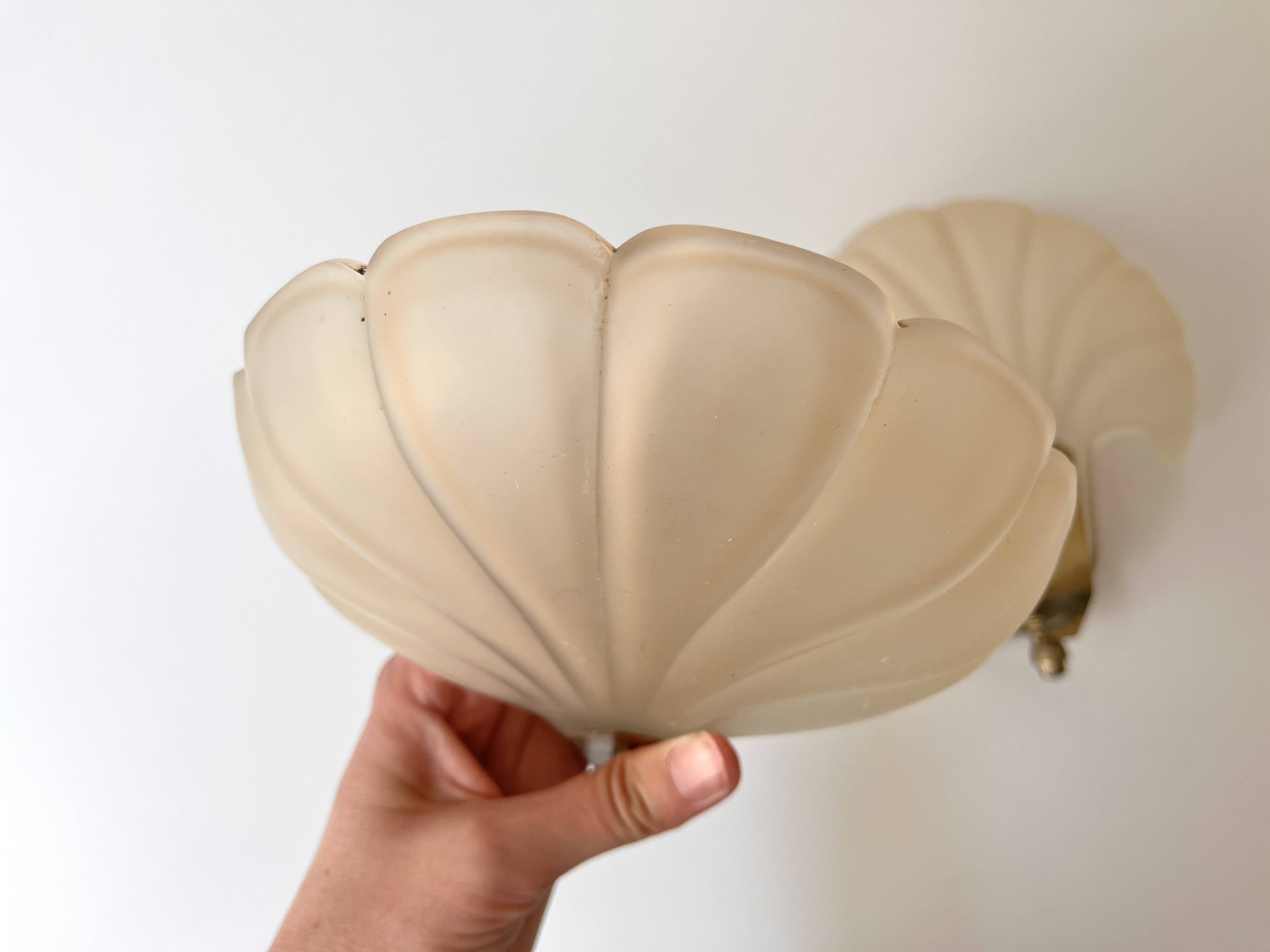 Pair of vintage shell glass wall lights, Art Deco style fixtures.