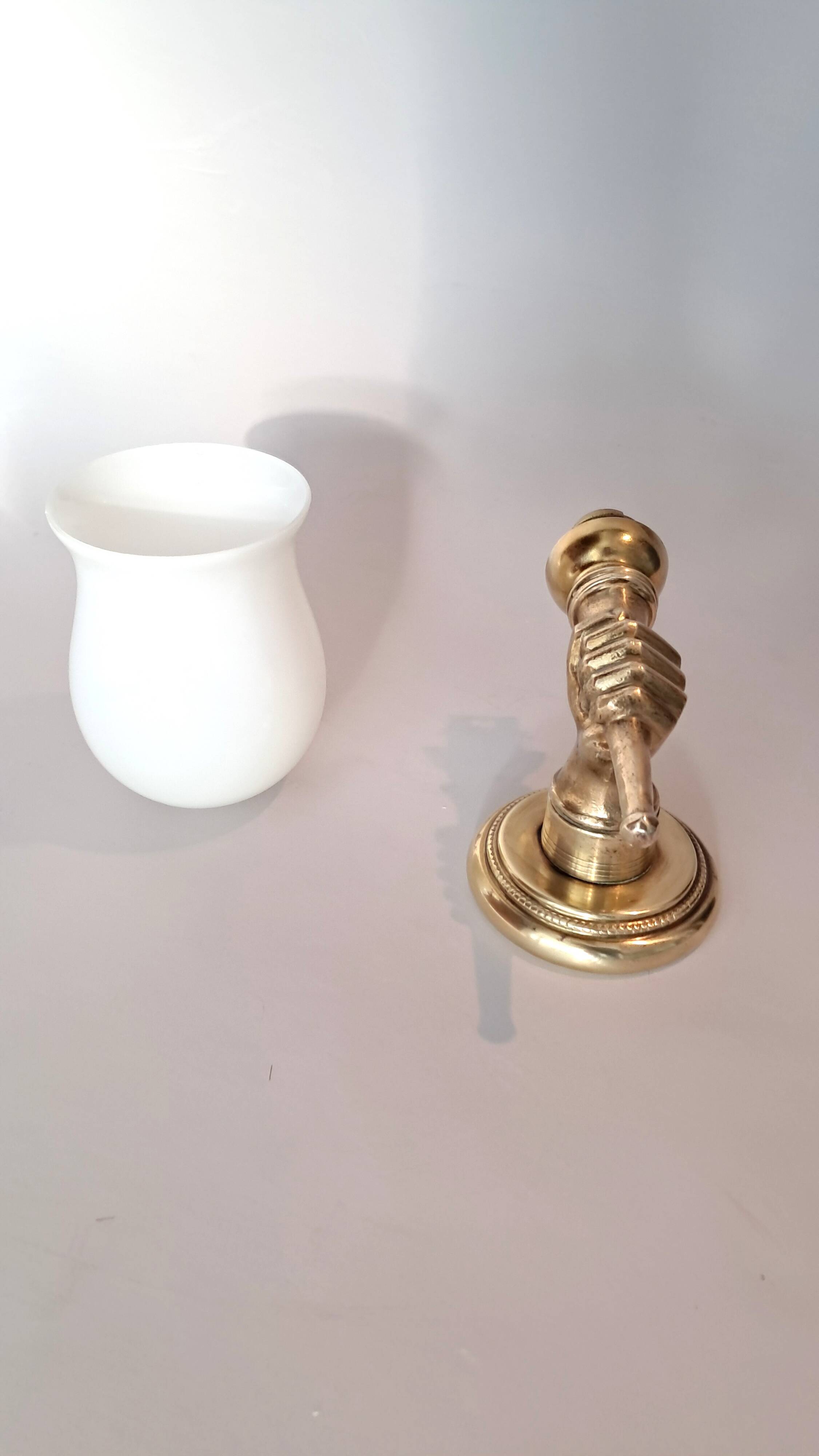 Golden brass wall light from the 1950s.