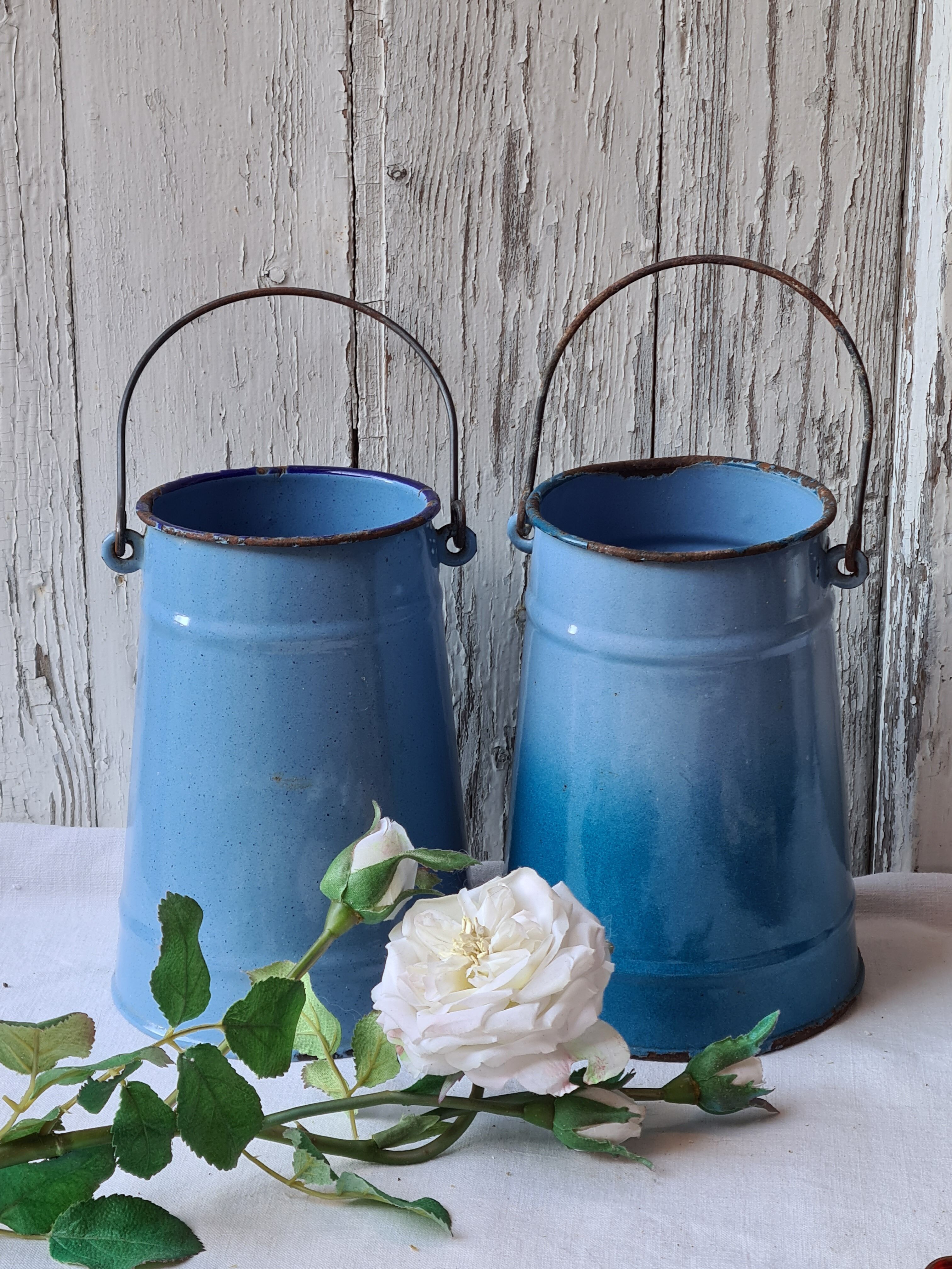 Two enamelled milk jars