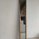 Long wooden mirror and gilded stucco with pearl rays H: 2m45 L: 40cm