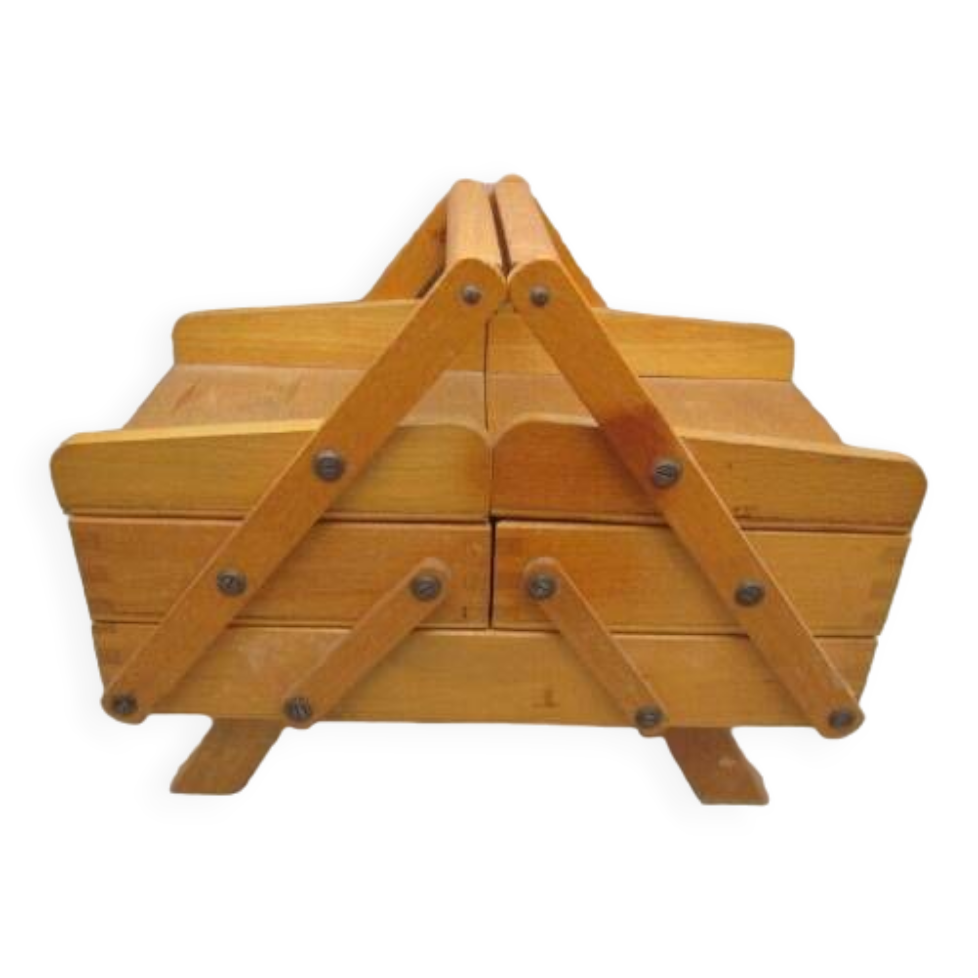 Little worker sewing old wooden table