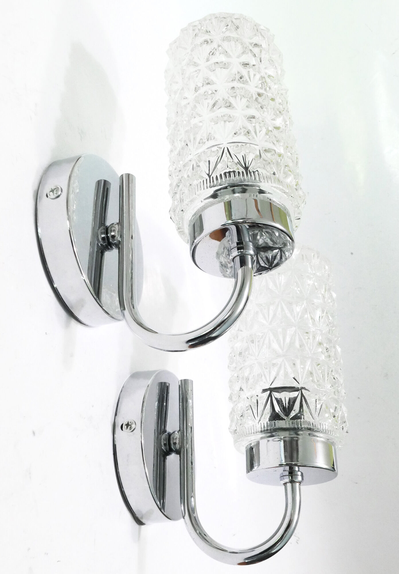 Pair of 1970 chrome metal wall light and molded glass globes.