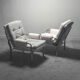 Pair of tubular armchairs double face '70