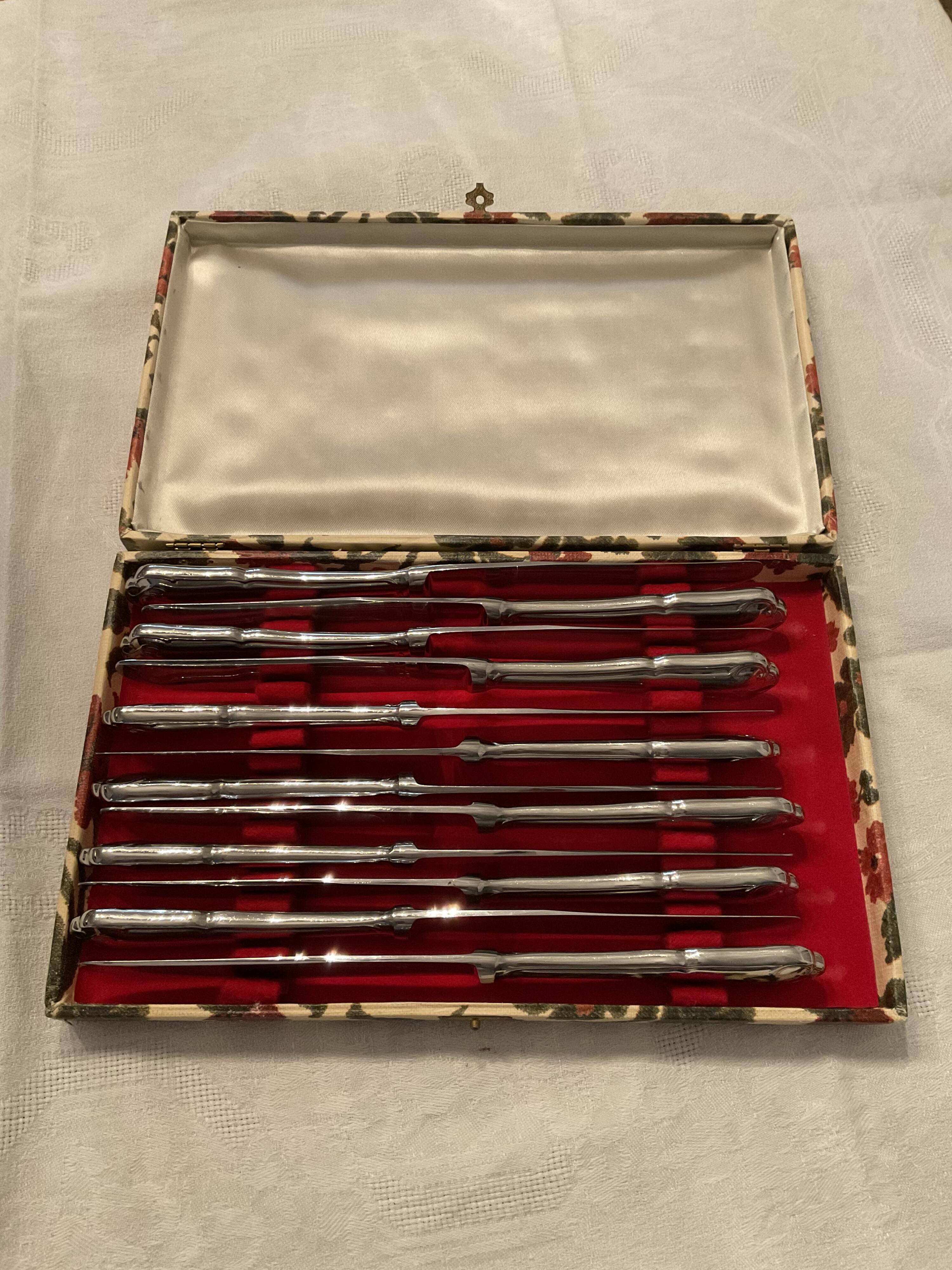 12 stainless steel knives. vintage