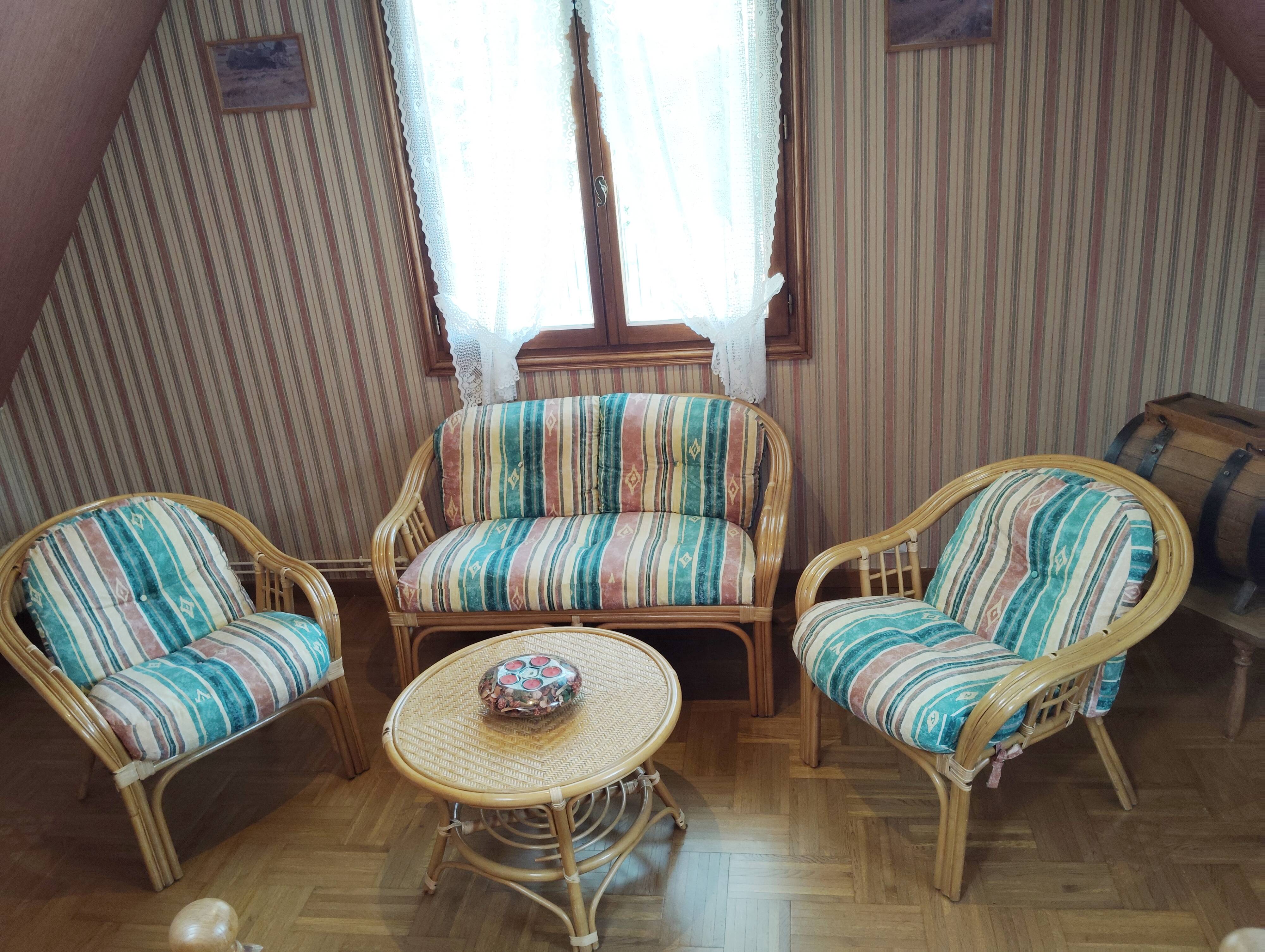 Rattan lounge with removable cushions