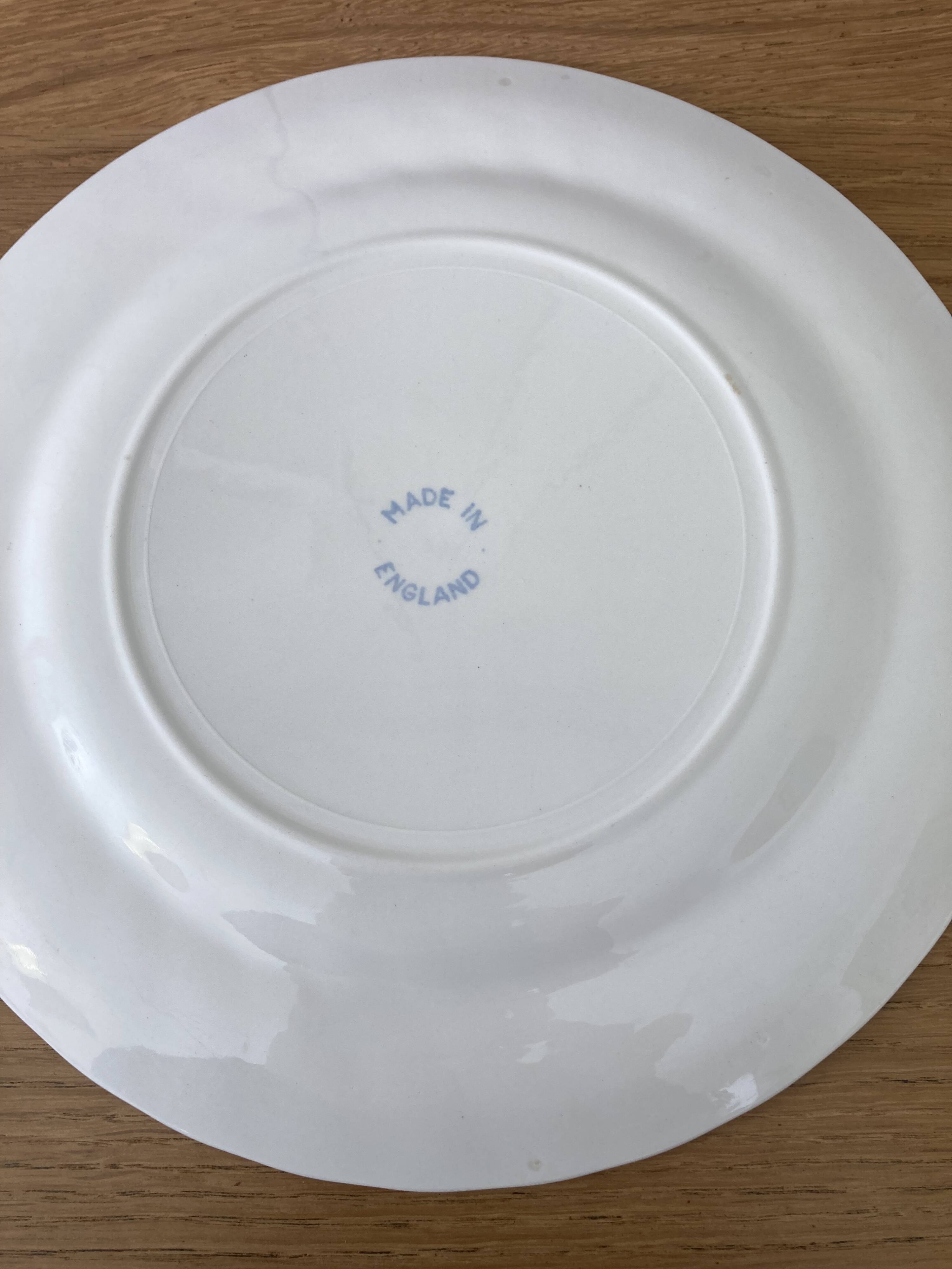 Four old blue plates