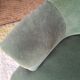 Green velvet armchair