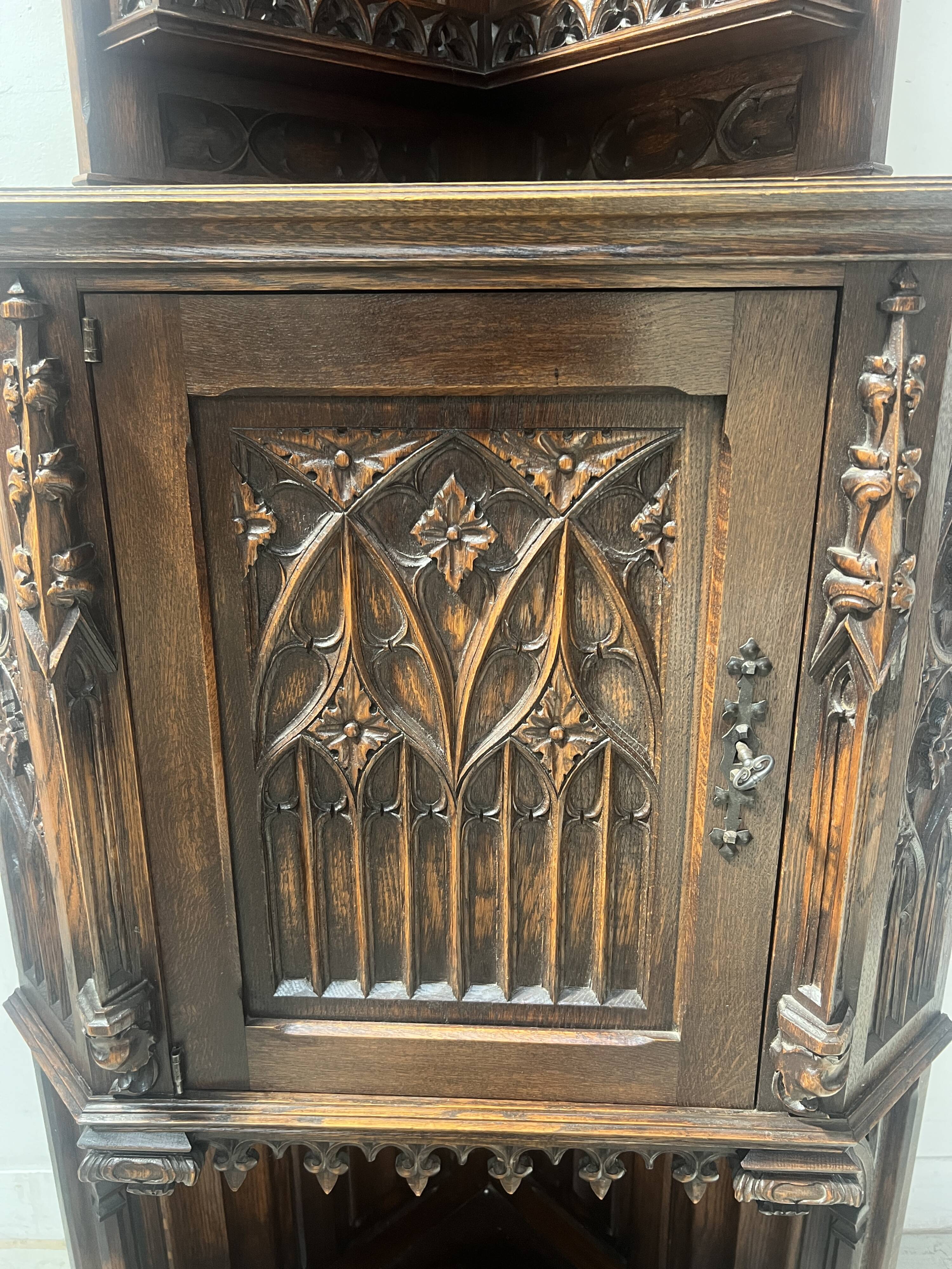 Gothic-style corner cabinet in solid oak, 20th century.