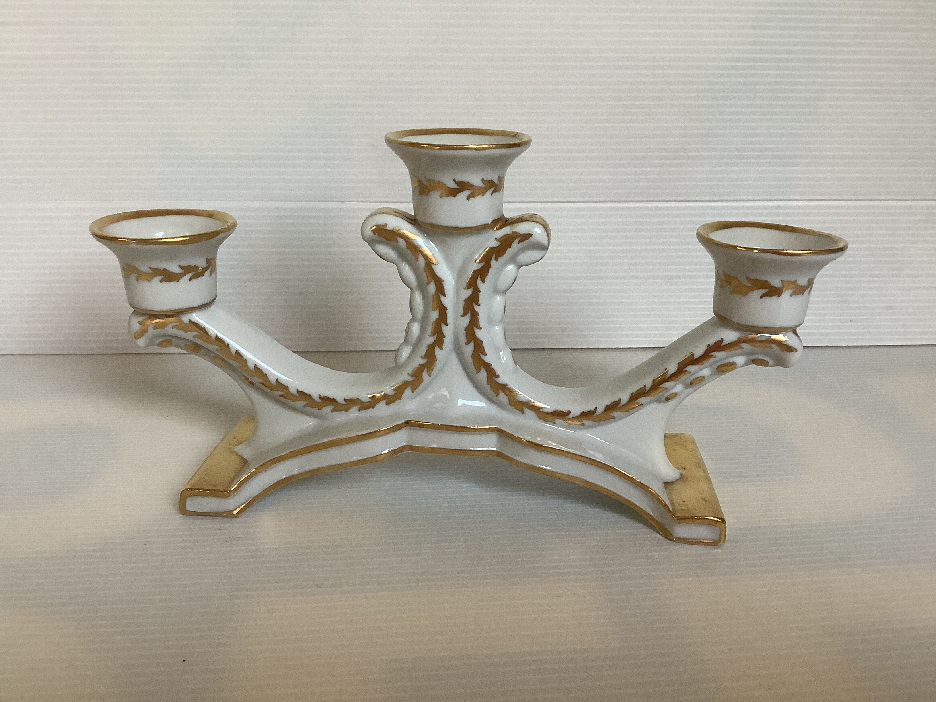 Old white and gold candlestick Belgium