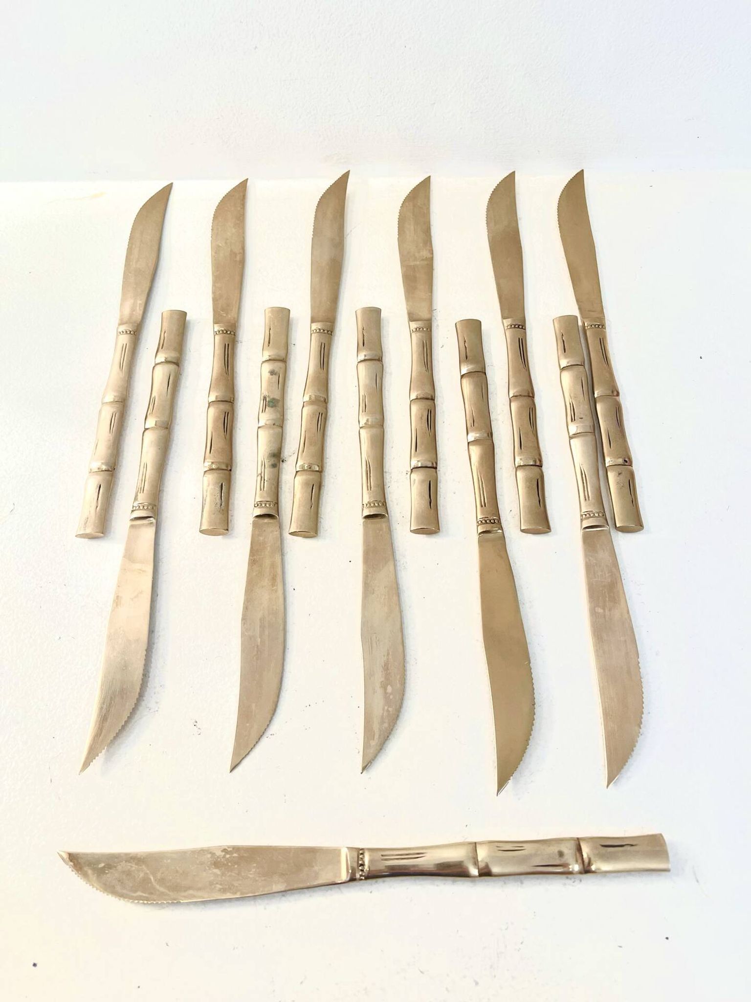 12 gold table knives, Hollywood Regency – circa 1970