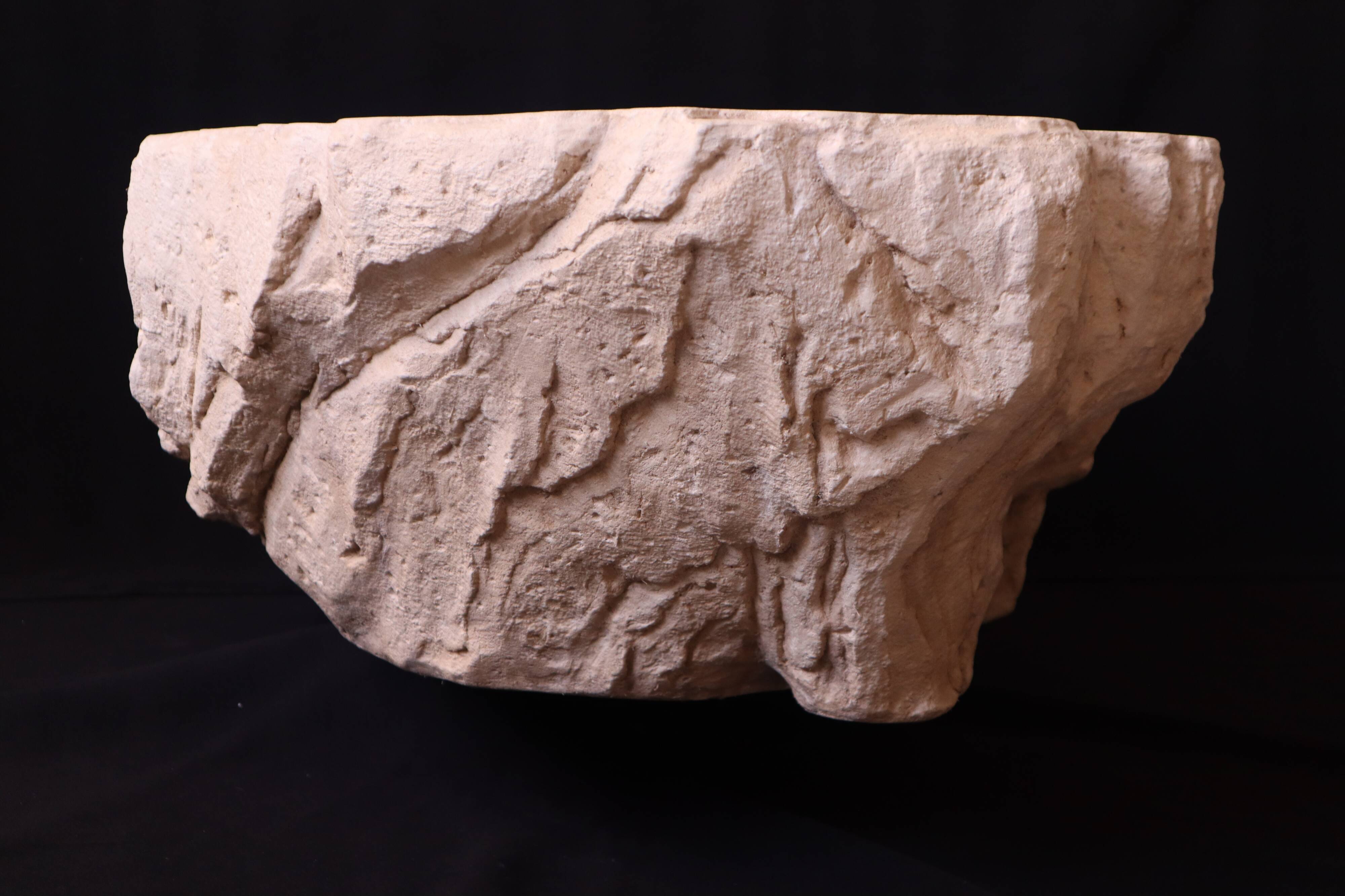Designer coffee table with travertine rock effect — unique handcrafted piece.