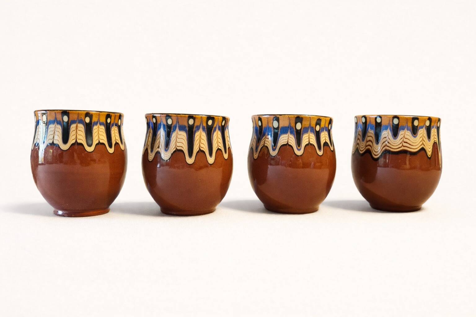 Set of 4 Bulgarian ceramic Troyan mugs from the 1970s, vintage glazed stoneware.