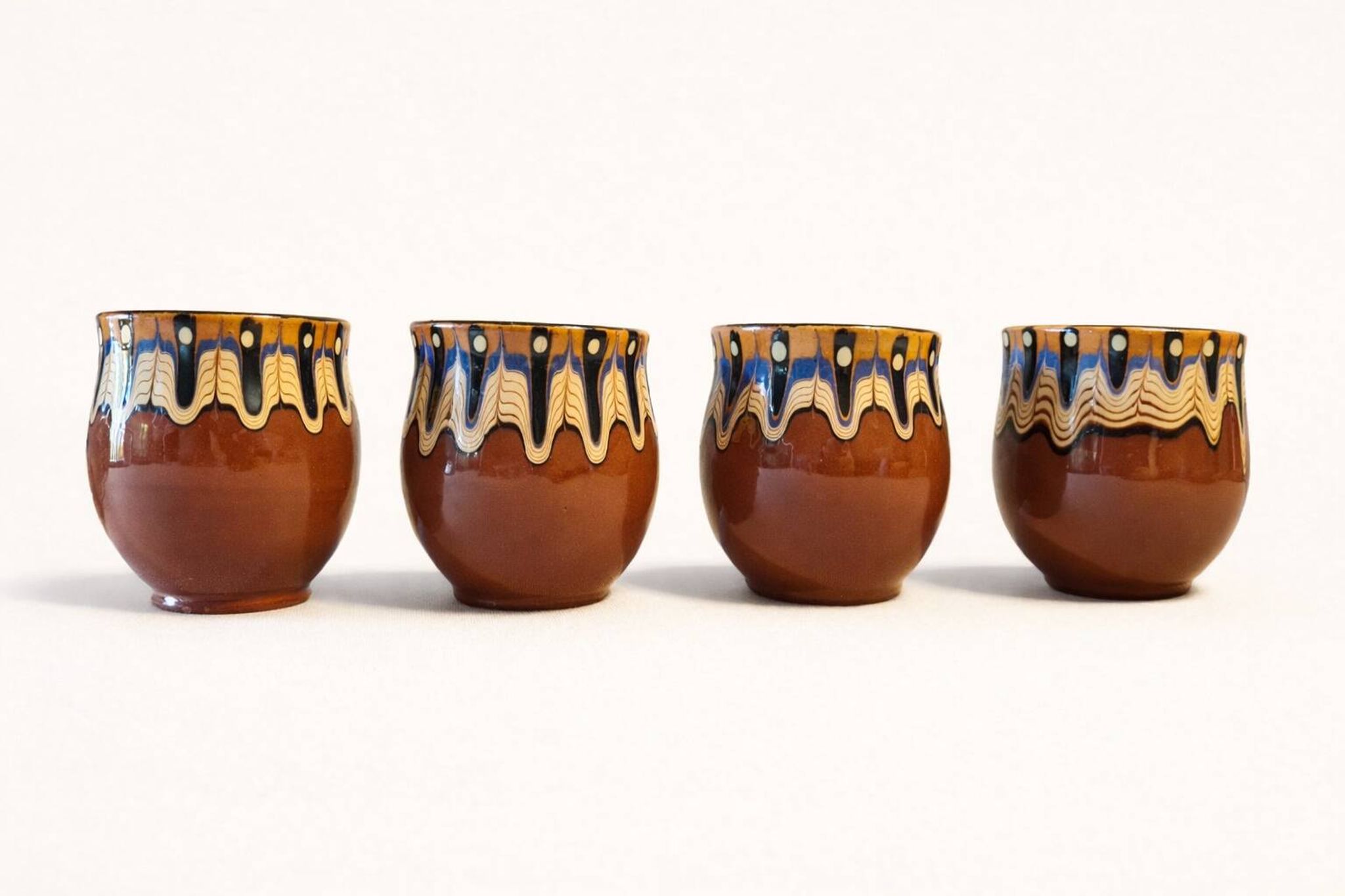 Set of 4 Bulgarian ceramic Troyan mugs from the 1970s, vintage glazed stoneware.