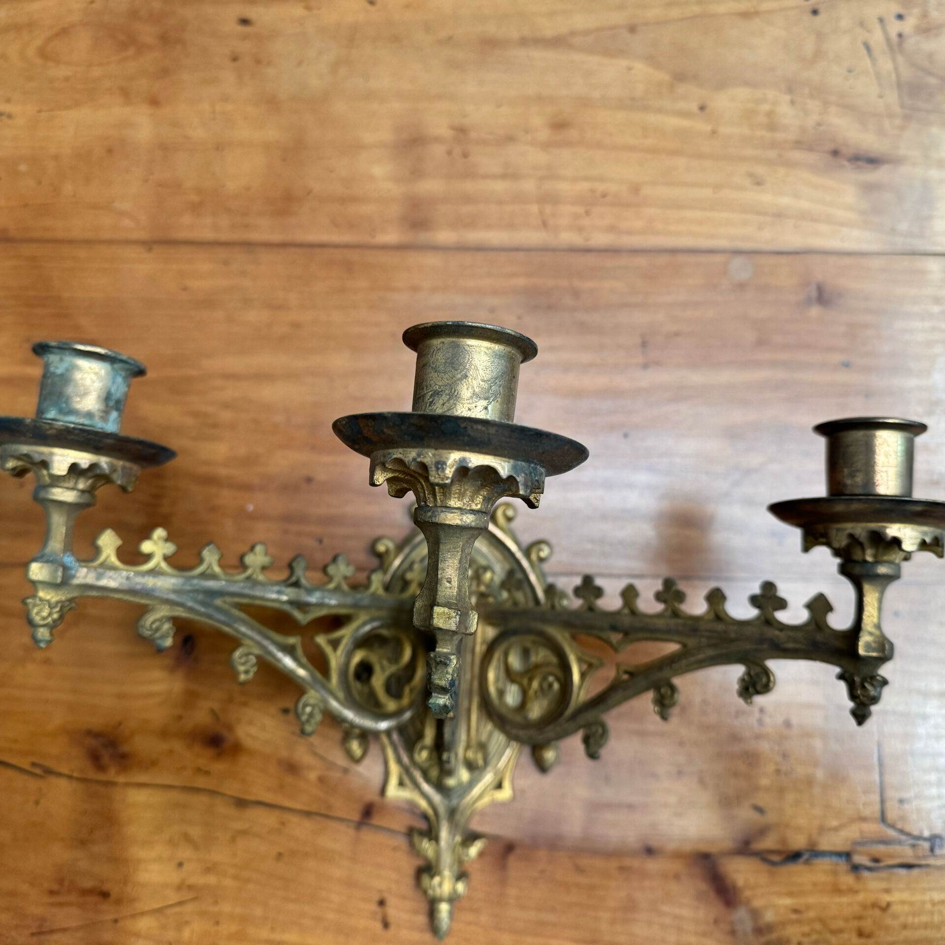 Elegant pair of three-light wall sconces from the 19th century.
