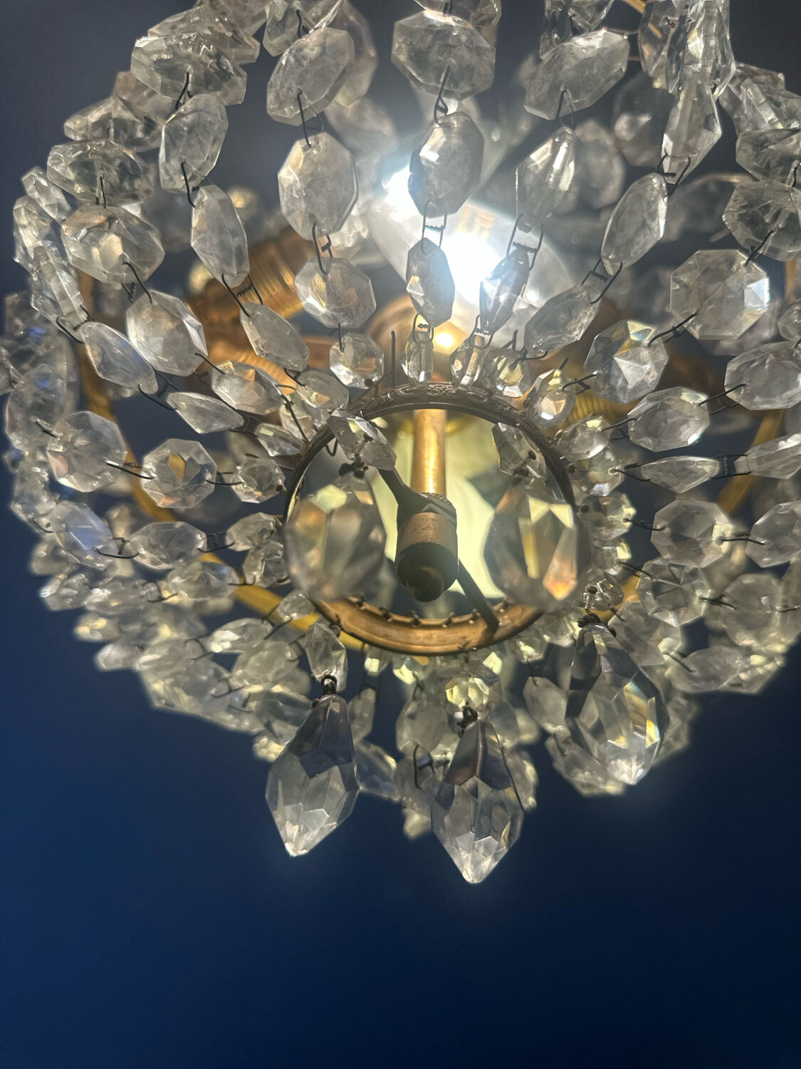 Basket chandelier with crystal and gilded brass pendants, circa 1930.