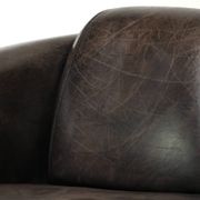 Cow leather Aviator design armchair in a dark colour scheme