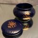 Porcelain candy box with golden floral decoration on a midnight blue background