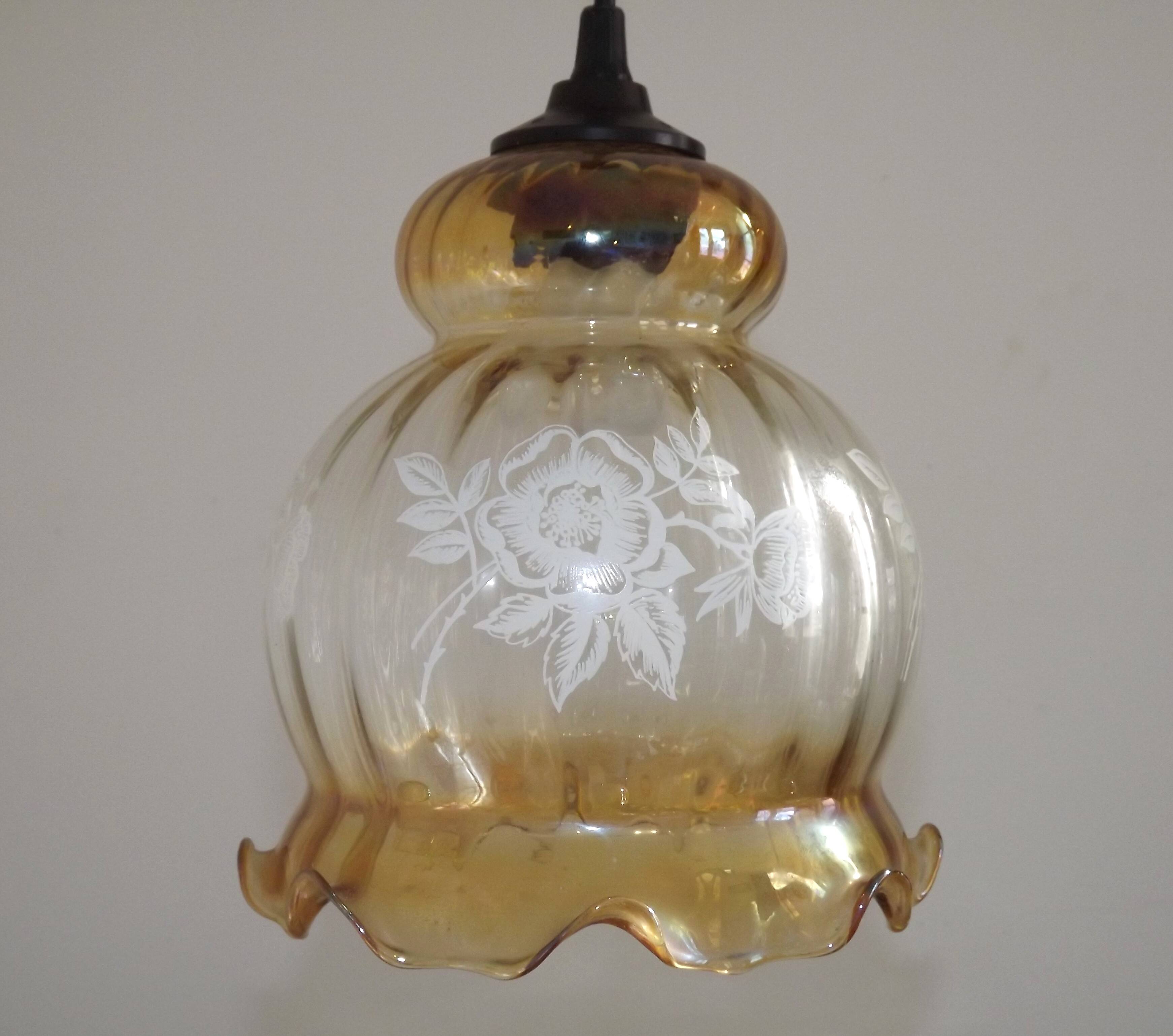 French vintage amber and clear glass ceiling light with white floral decoration.
