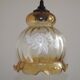 French vintage amber and clear glass ceiling light with white floral decoration.