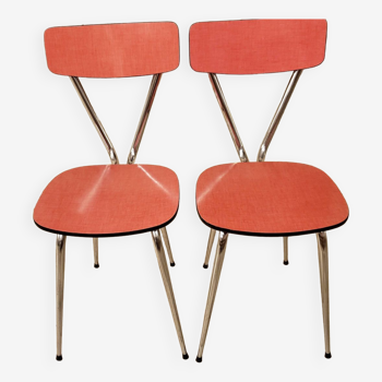 Pair of red tublac formica chairs with chrome metal legs