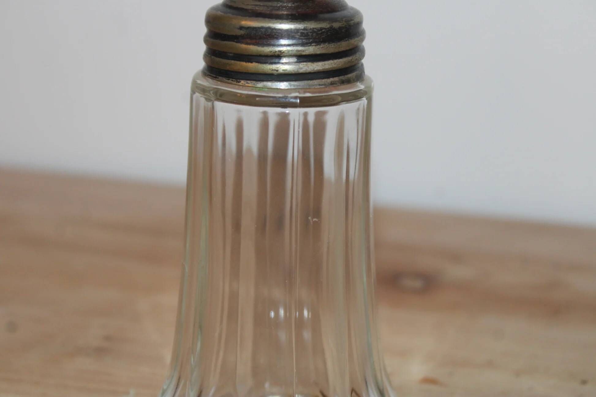 Vintage striped glass and patinated metal oil serving utensil.