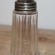 Vintage striped glass and patinated metal oil serving utensil.