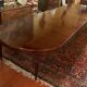 Extensible dining table from the Louis XVI period in mahogany with a banded top.