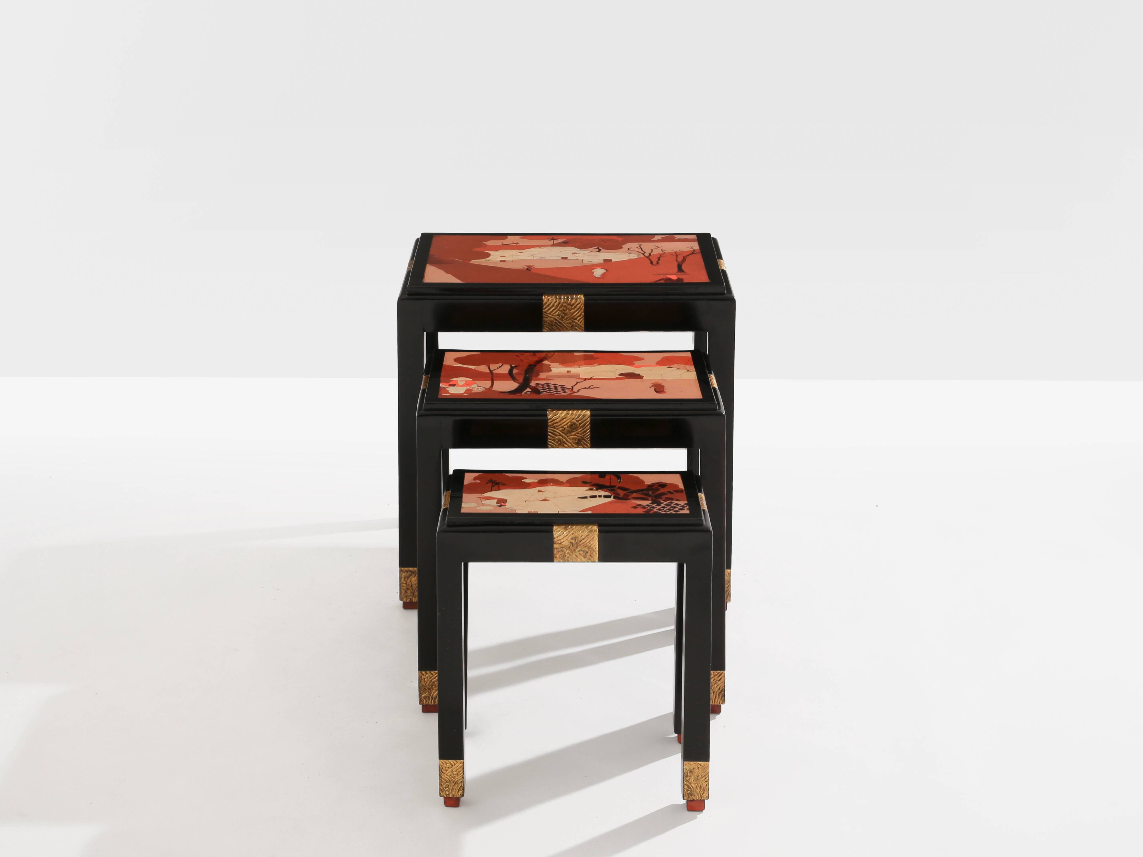 Set of three nesting tables with Asian decor, blackened wood, circa 1920.