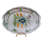 Old oval dish with floral motif called black bottom with staples